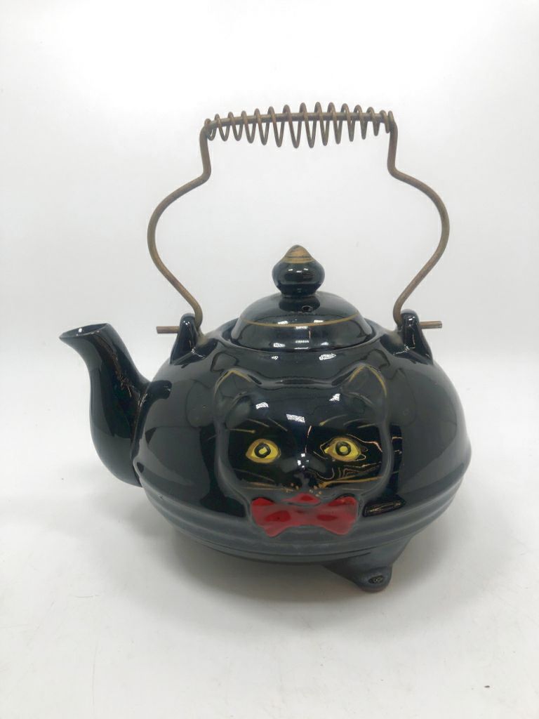 VTG BLACK CAT REDWARE TEAPOT W/RED BOW METAL HANDLE.