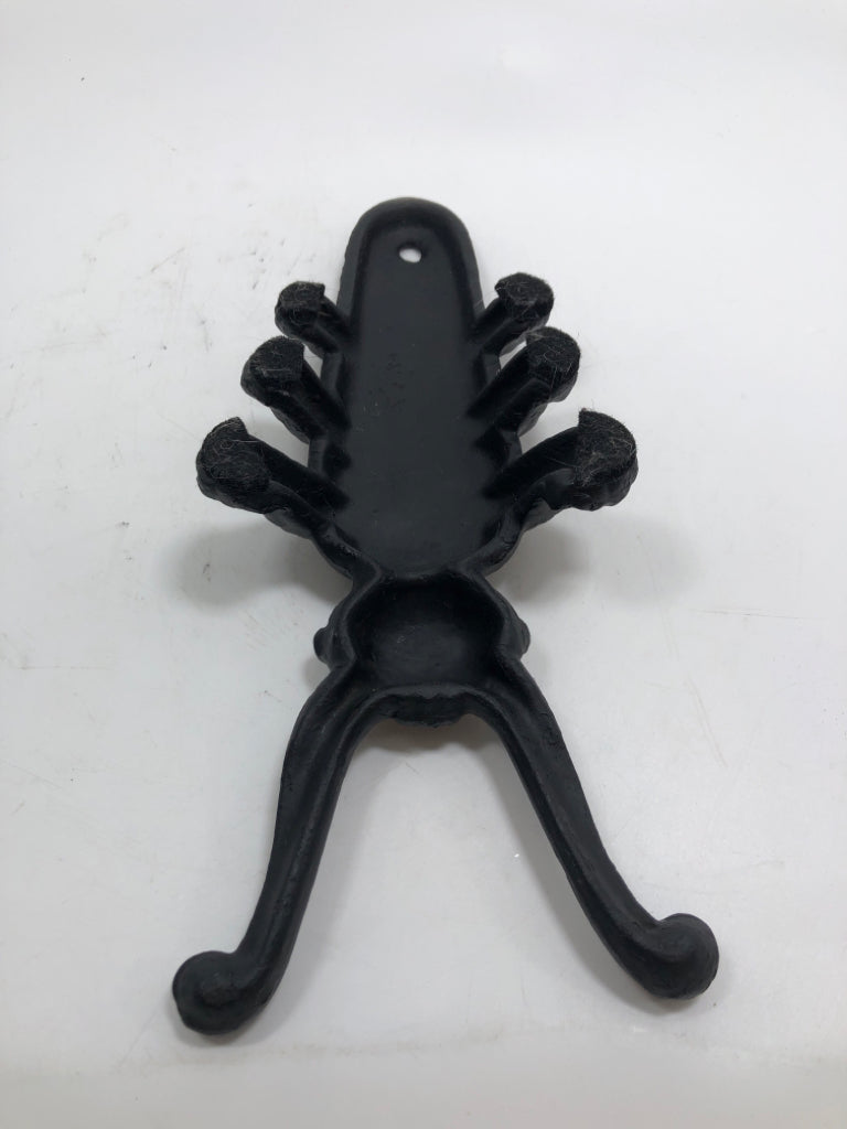 BLACK METAL BEETLE BOOT JACK.