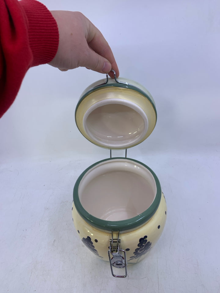 CERAMIC CANISTER W/ PURPLE FLOWERS GREEN POLKA DOT LID.