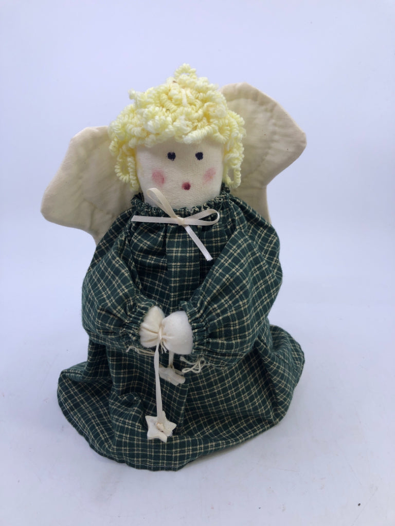 SOFT WHITE ANGEL IN GREEN FLANNEL DRESS.