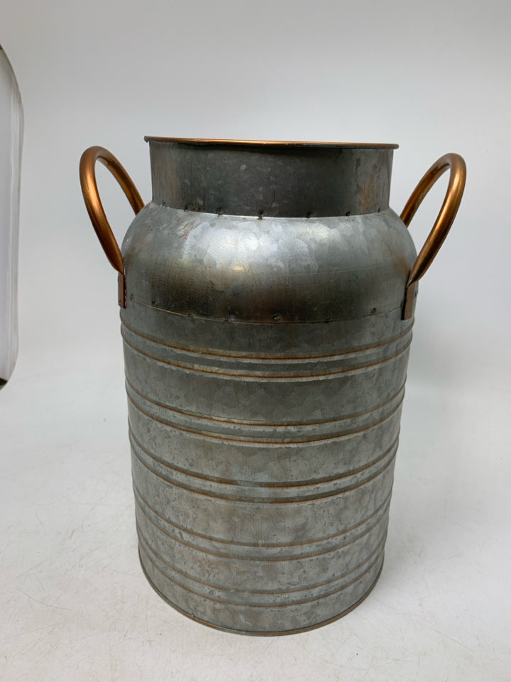 GALVANIZED BUCKET W/ COPPER COLORED DETAILS.