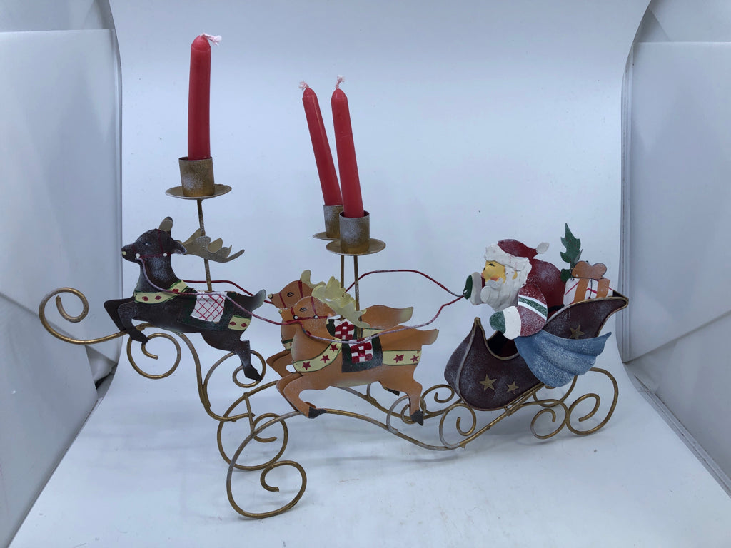 METAL SANTA IN SLEIGH CANDLE HOLDER.