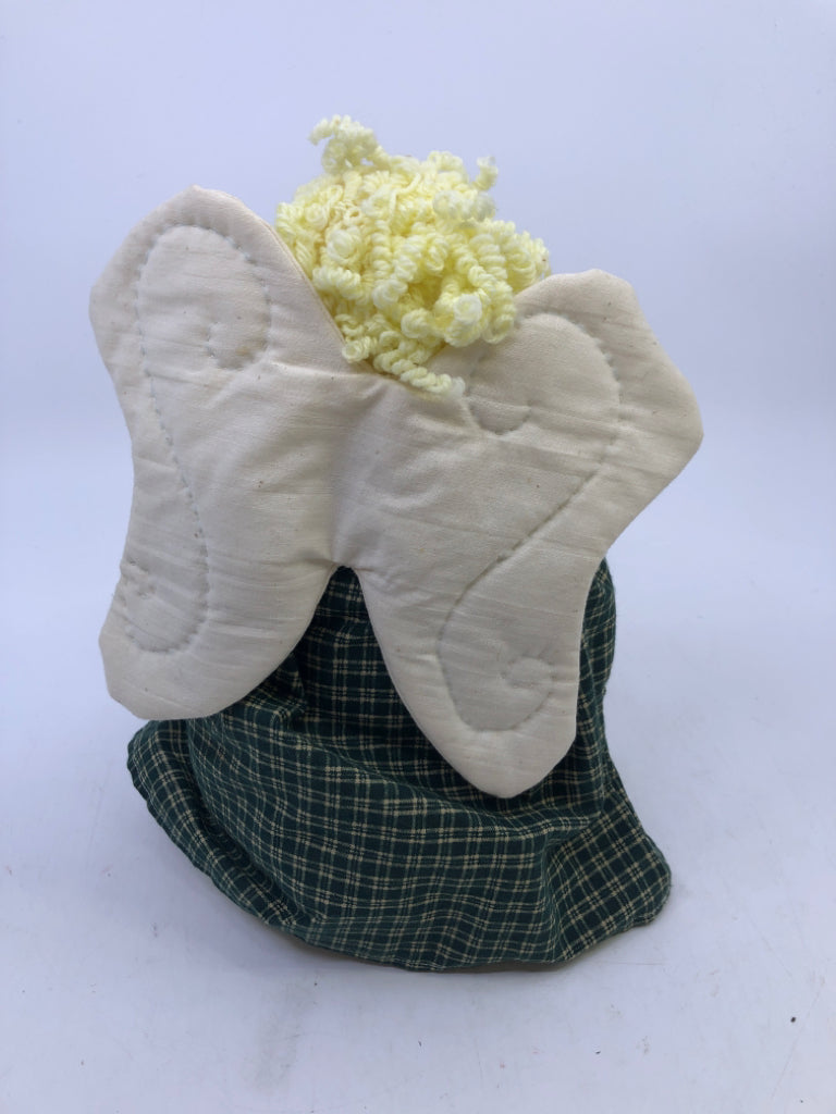 SOFT WHITE ANGEL IN GREEN FLANNEL DRESS.