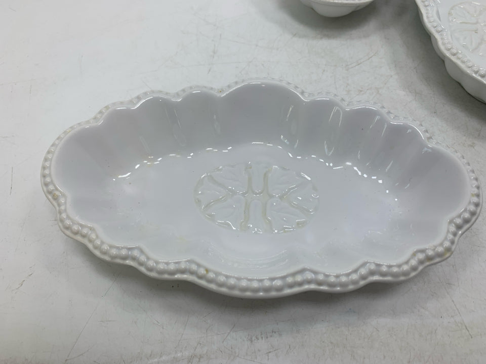 4 OVAL SCALLOP EDGE BOWLS.