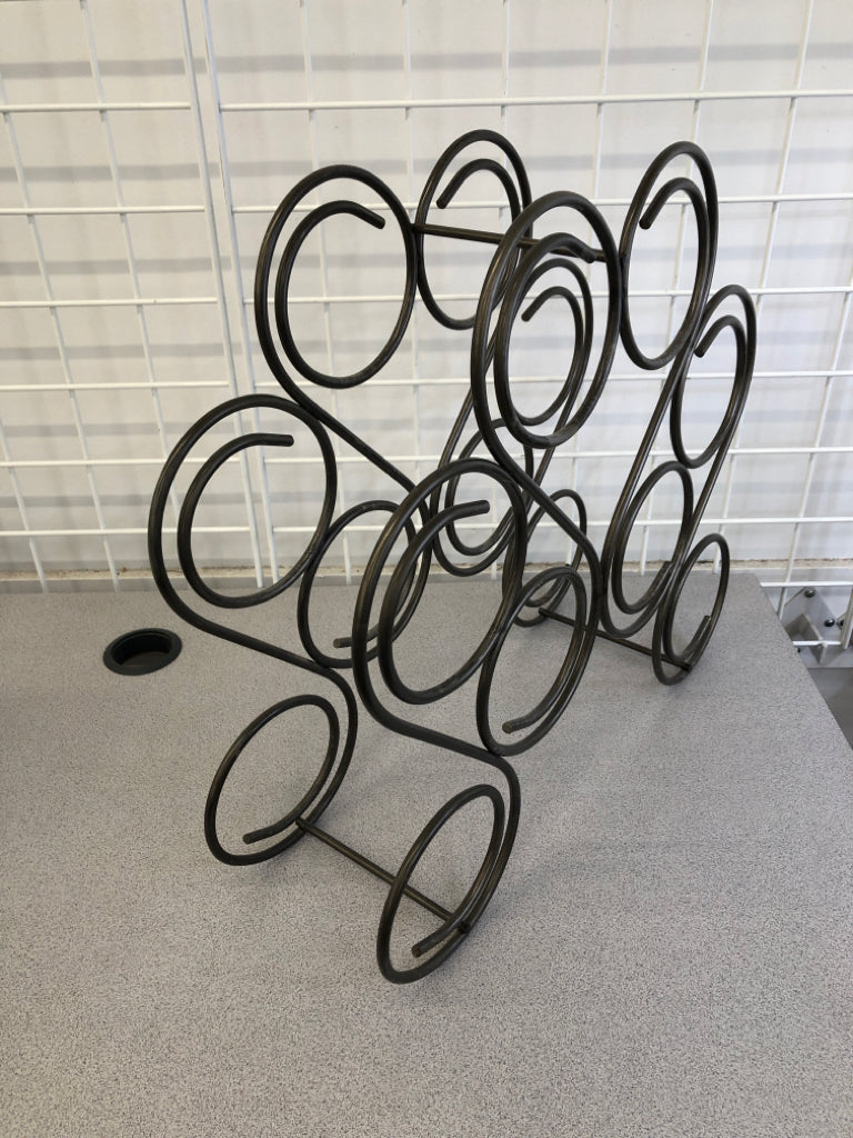 SILVER METAL SCROLL WINE RACK.