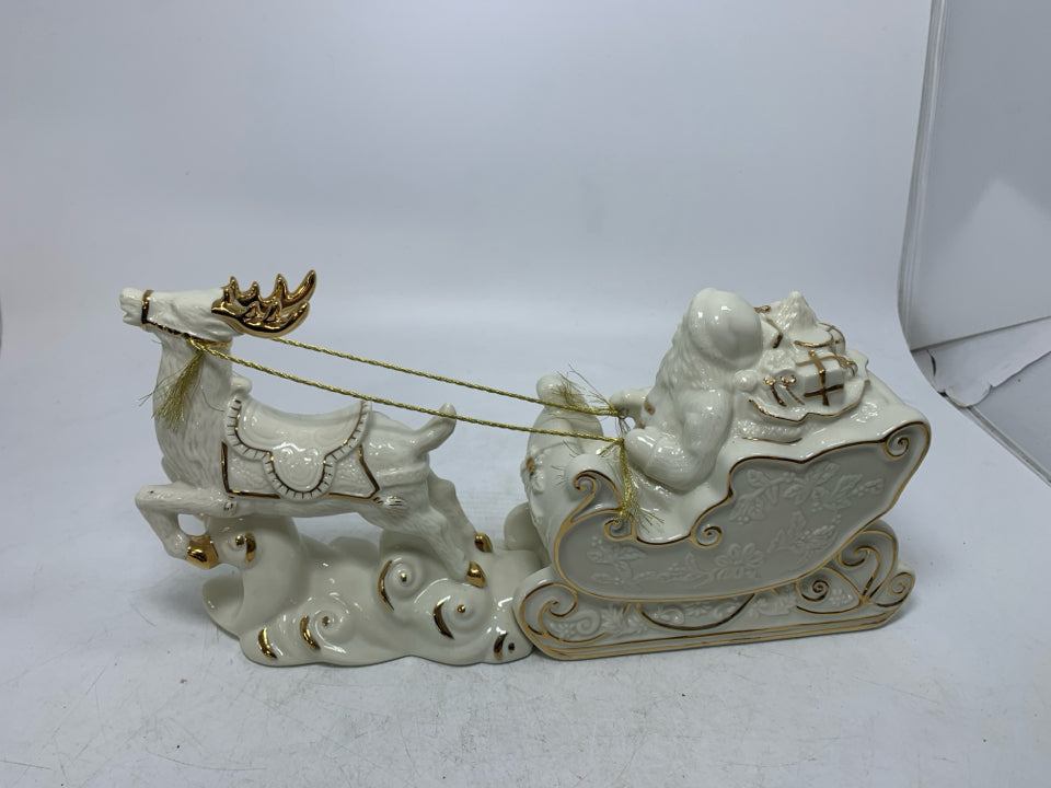 MIKASA IVORY SANTA IN SLAY W/ REINDEER GOLD DETAILS.