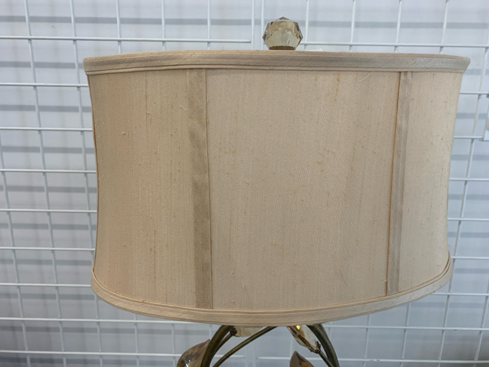 GOLD BASE LAMP W/CRYSTAL LEAVES AND CREAM SHADE.