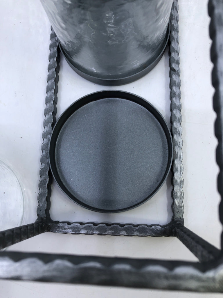 3 CANDLE HOLDERS IN METAL HOLDER.