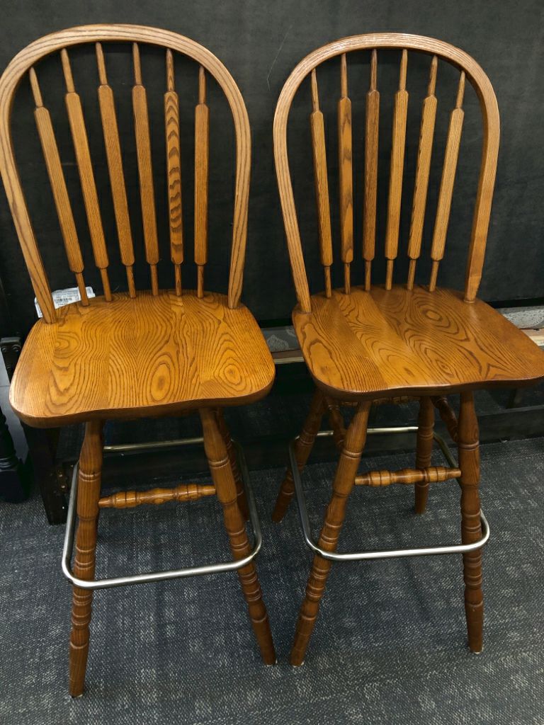 2 WOODEN SWIVEL CHAIRS.