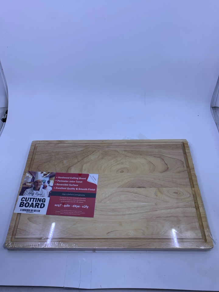 NIP WOOD CUTTING BOARD.