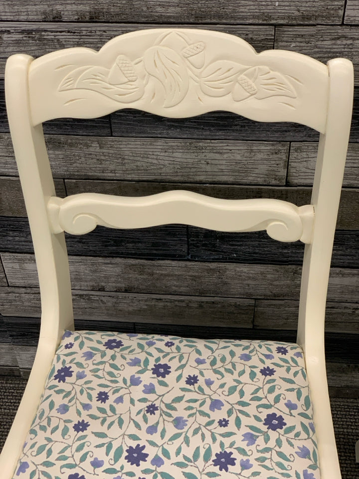 2 CREAM PAINTED SIDE CHAIRS W/BLUE FLORAL FABRIC SEAT.