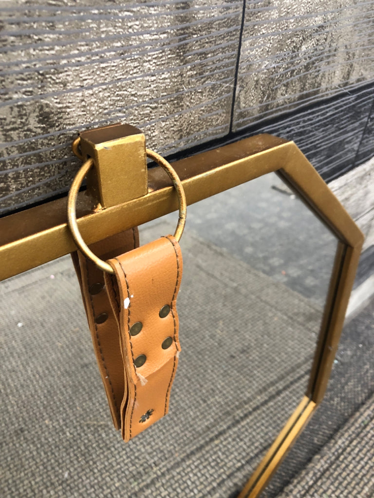 OCTAGONAL GOLD MIRROR W/LEATHER STRAP WALL HANGING.