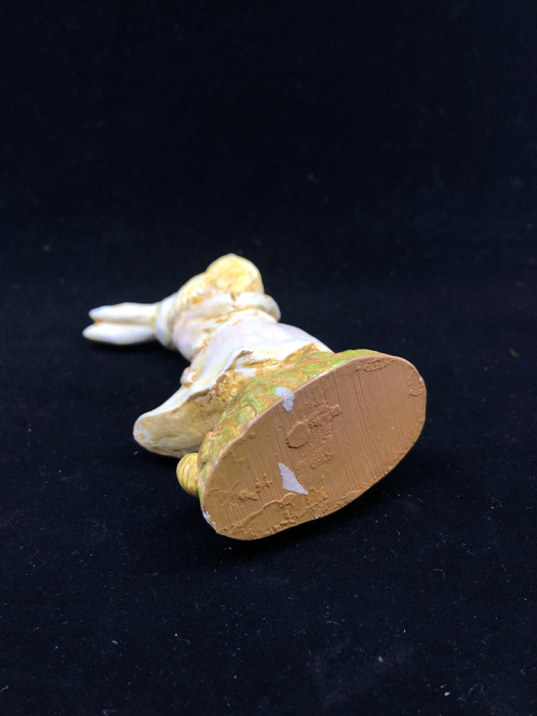 BUNNY HOLDING NET FIGURINE.
