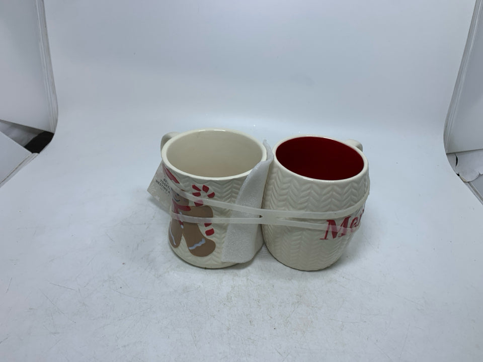 2 NWT CREAM TEXTURED MERRY/GINGERBREAD MAN MUGS.