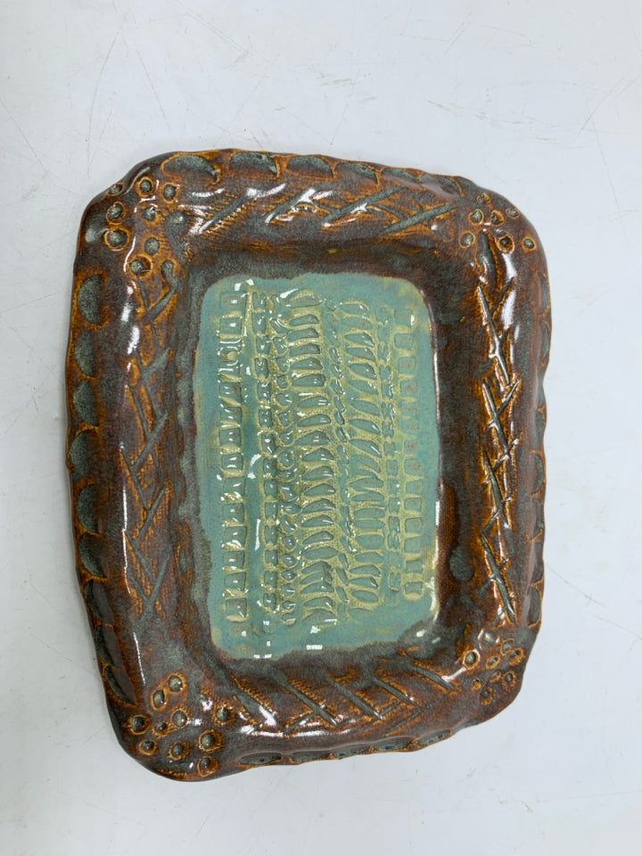 TEXTURED TEAL POTTERY SOAP DISH W/ DARK EDGES.