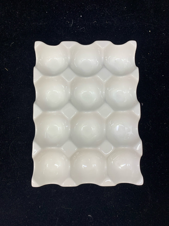 WHITE CERAMIC EGG HOLDER.