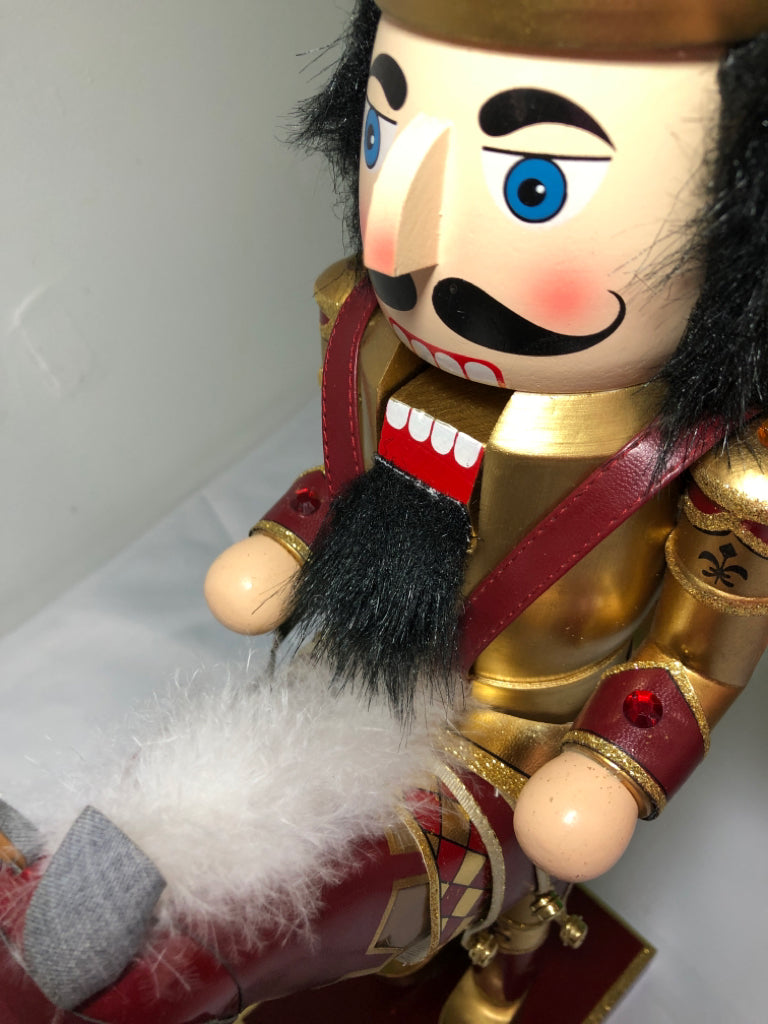 RED AND GOLD NUT CRACKER .