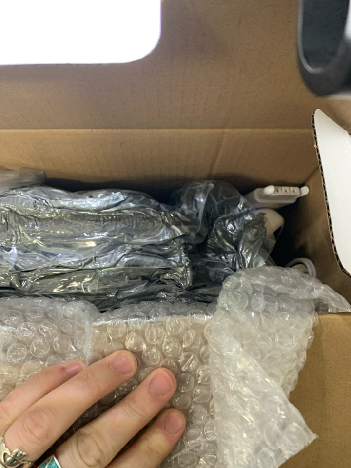 NIB WEARABLE HEATED BLANKET.