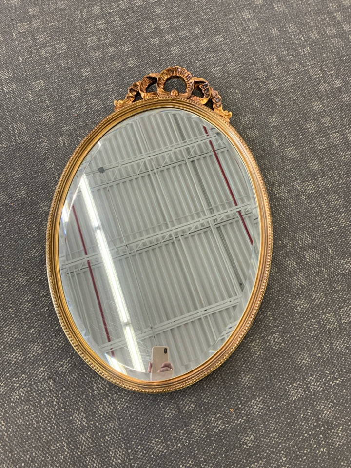 LARGE GOLD PAINTED MIRROR W/ BEADED EDGE W/ CUTOUT ON TOP.