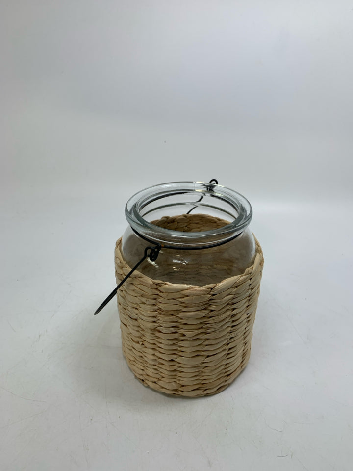 GLASS JAR W/ BASKET WOVEN OUTSIDE LANTERN.