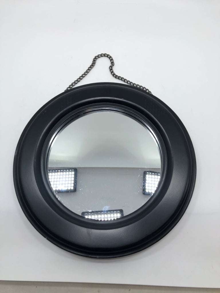 ROUND BLACK HANGING MIRROR.