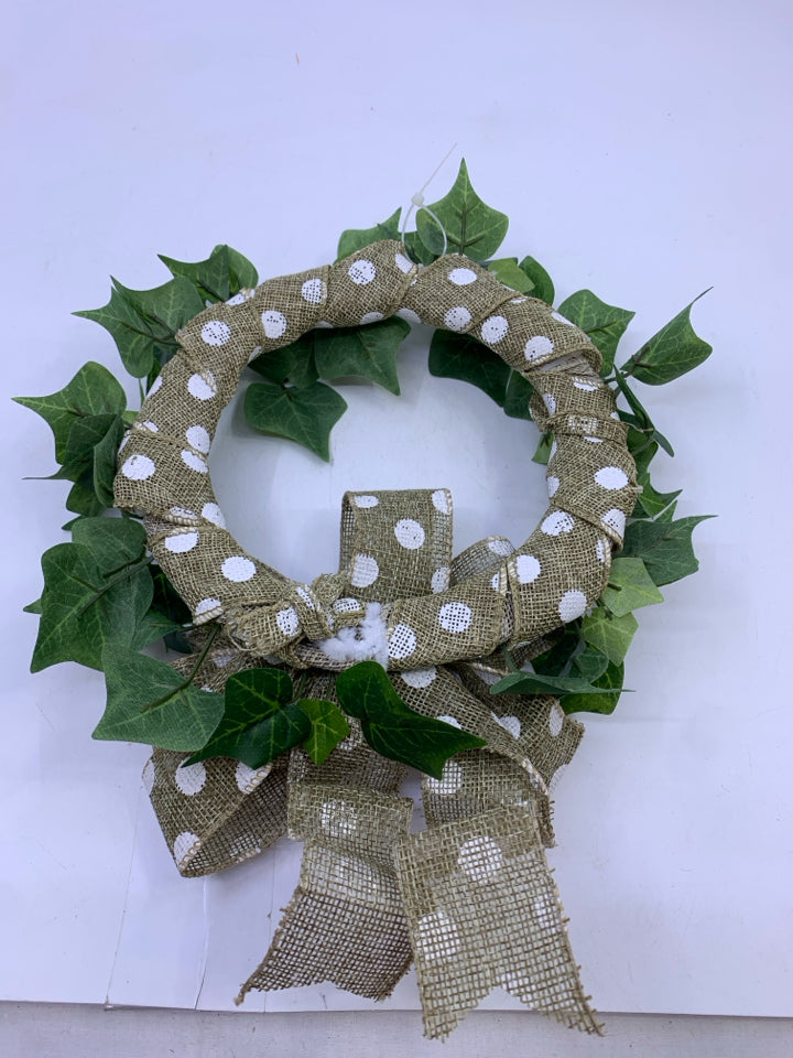 GREEN IVY WREATH WITH POLKA DOT RIBBON.