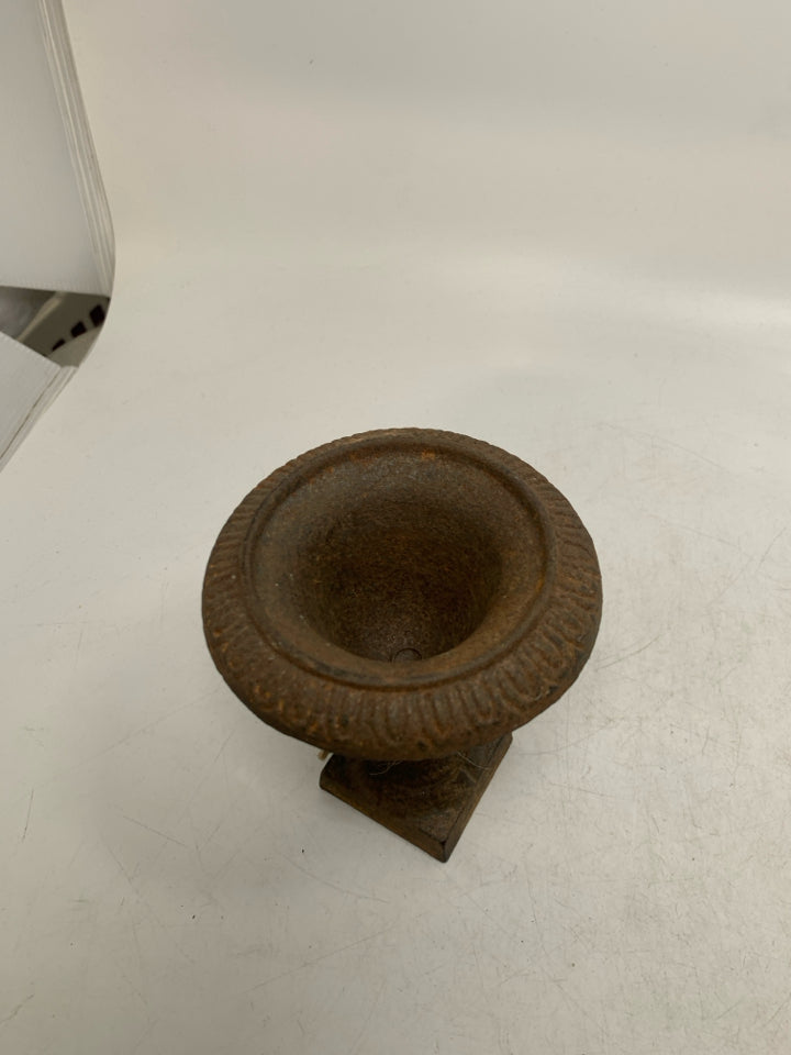 RUSTED HEAVY METAL FOOTED VASE.