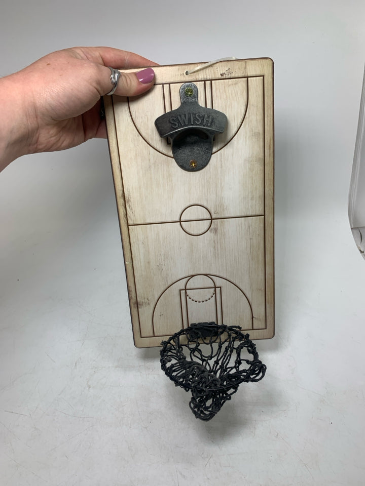 BOTTLE OPENER W/ CATCHING NET AT BOTTOM.