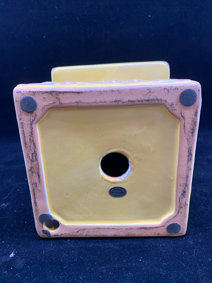 YELLOW, PINK, WHITE FLORAL DESIGN CANDLE PEDESTAL.