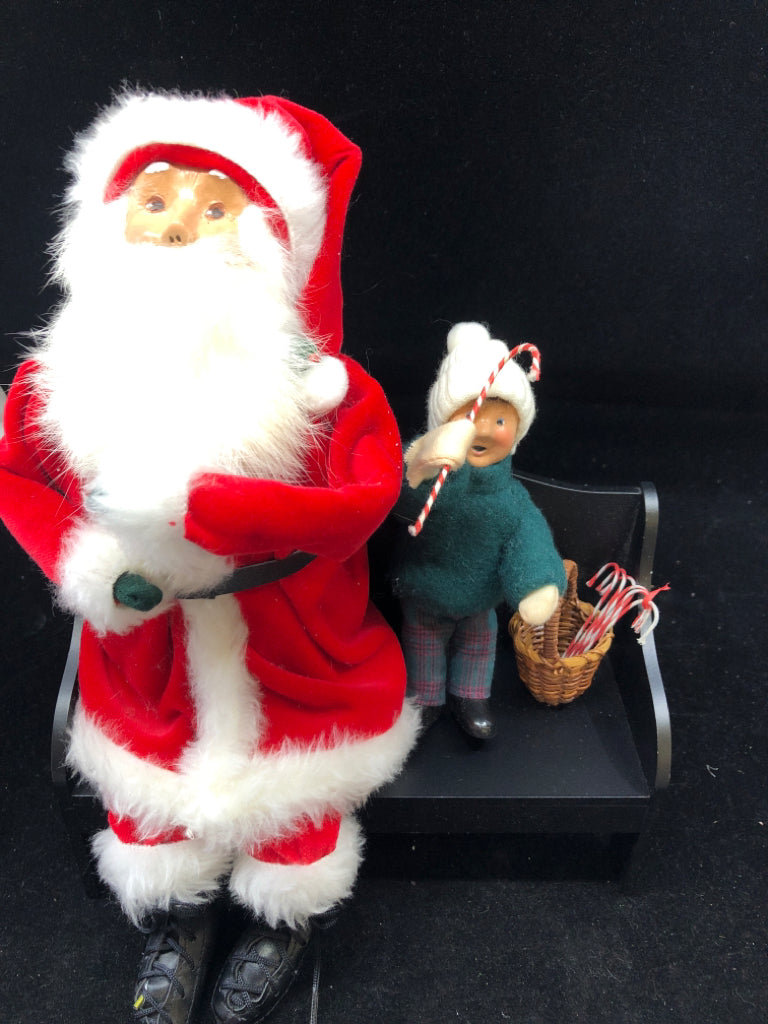 SANTA AND LITTLE BOY BYERS' CHOICE ON BENCH.