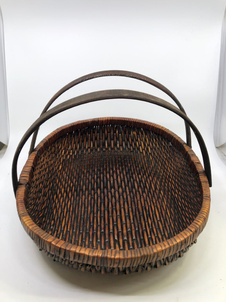 DARK BROWN OVAL BASKET W/ 2 HANDLES.