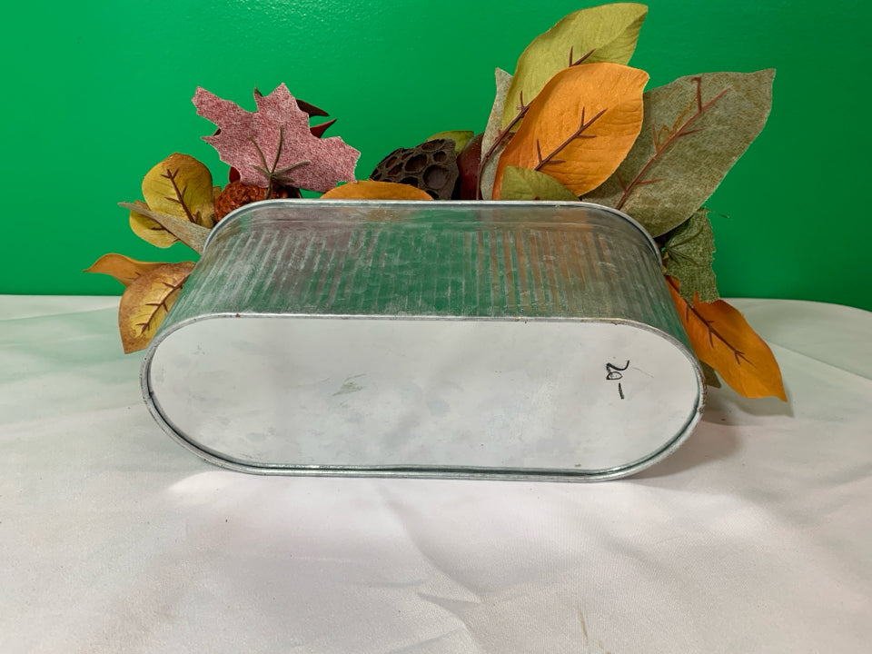 GALVANIZED OVAL RIBBED PLANTER W/ FAUX FALL DECOR.