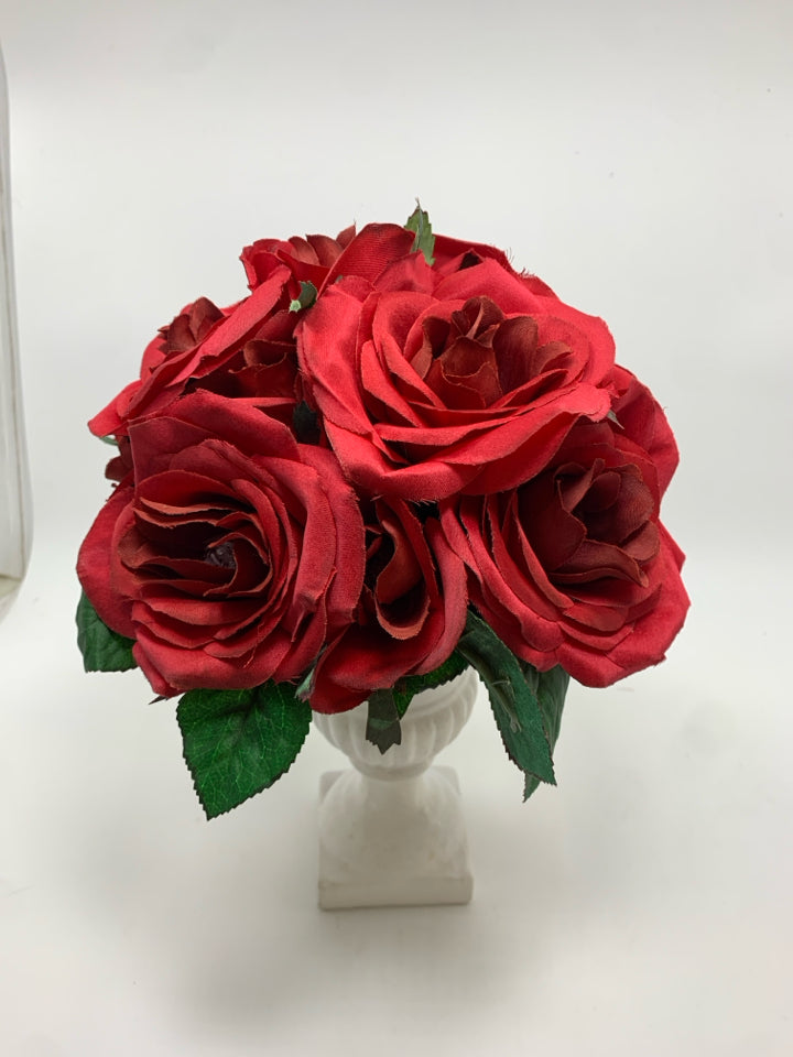 RED ROSES IN WHITE URN VASE.