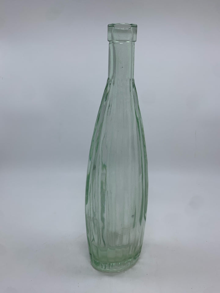 CLEAR GLASS RIBBED BOTTLE.