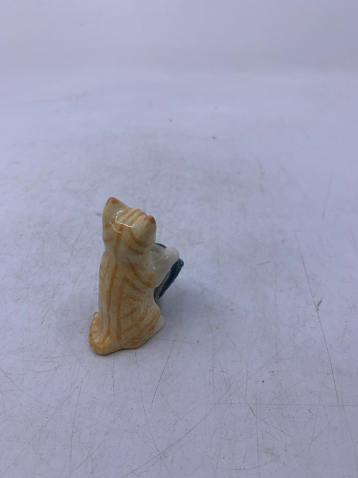 PORCELAIN CAT WITH SLIPPER.