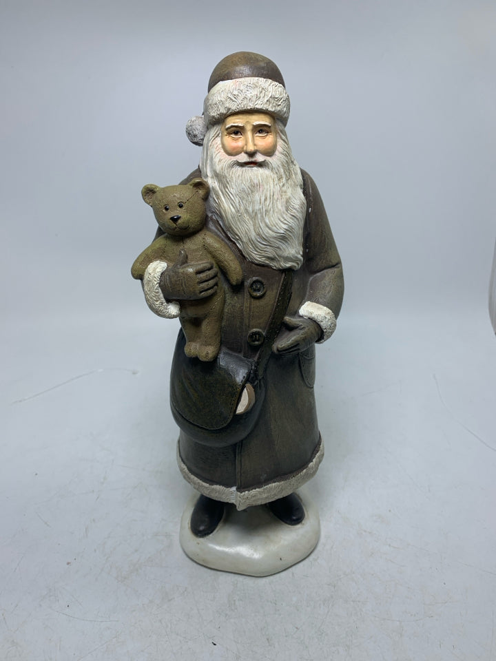 RESIN SANTA IN BROWN SUIT HOLDING TEDDY BEAR.