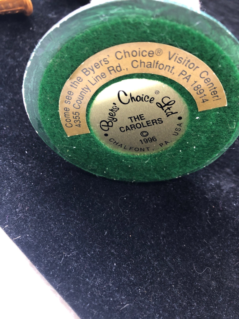 BYERS' CHOICE MAN HOLDING CHRISTMAS TREE- 1996.