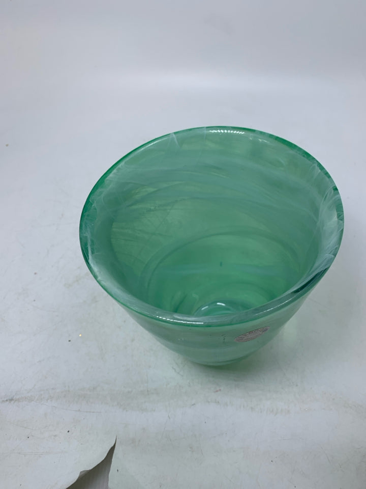 HEAVY GREEN GLASS VASE W/ WHITE SWIRL DETAILS.