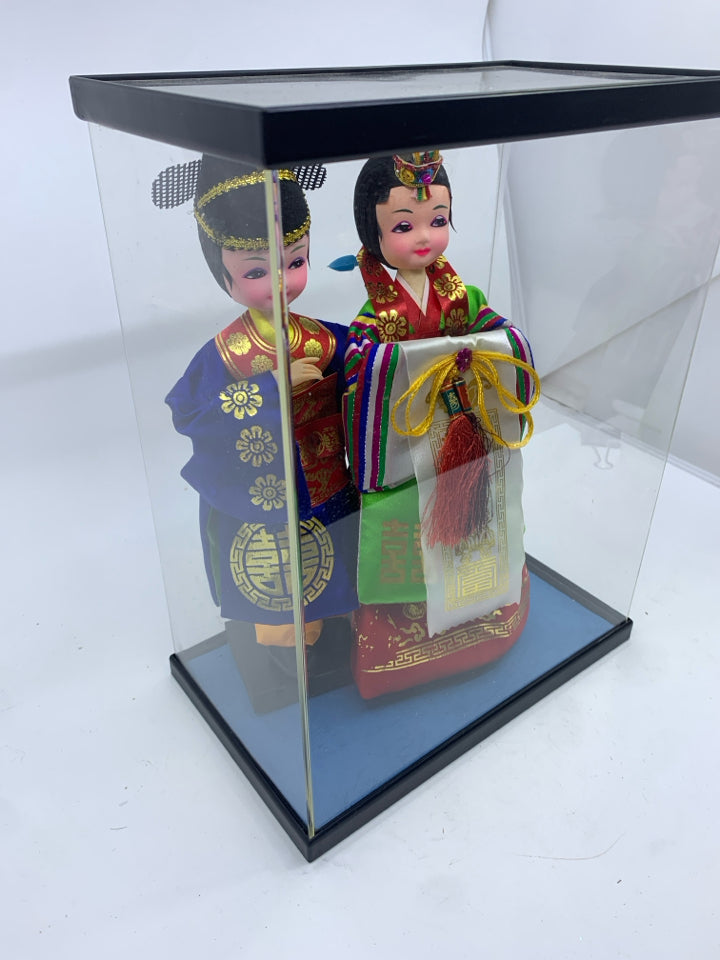 2 ASIAN STYLE DOLLS IN CASE.