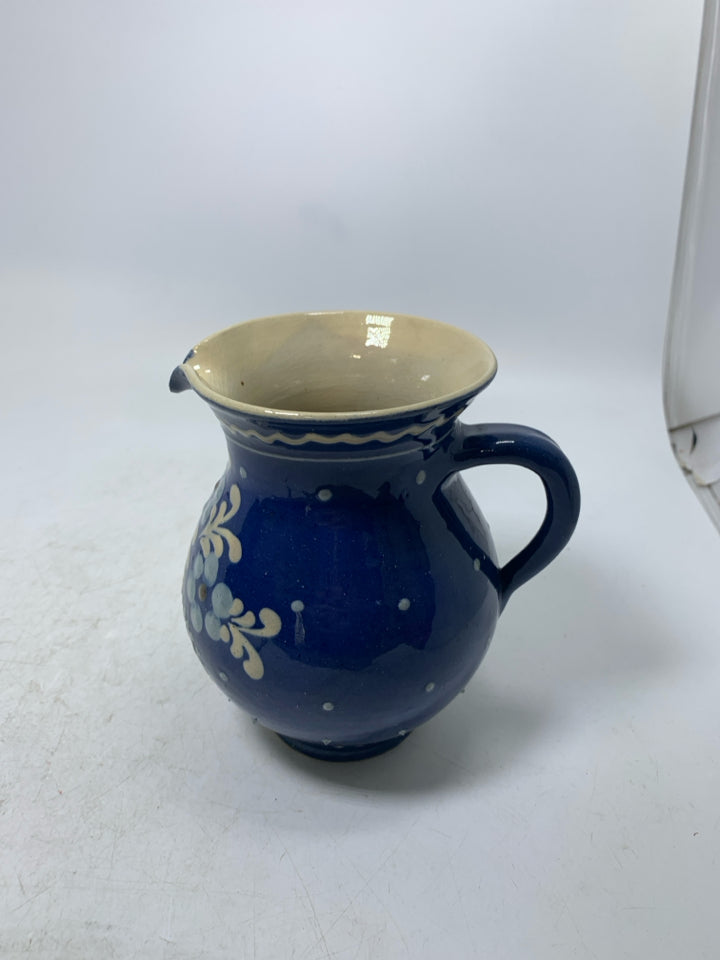 DARK BLUE CREAMER W/ PAINTED FLOWERS.