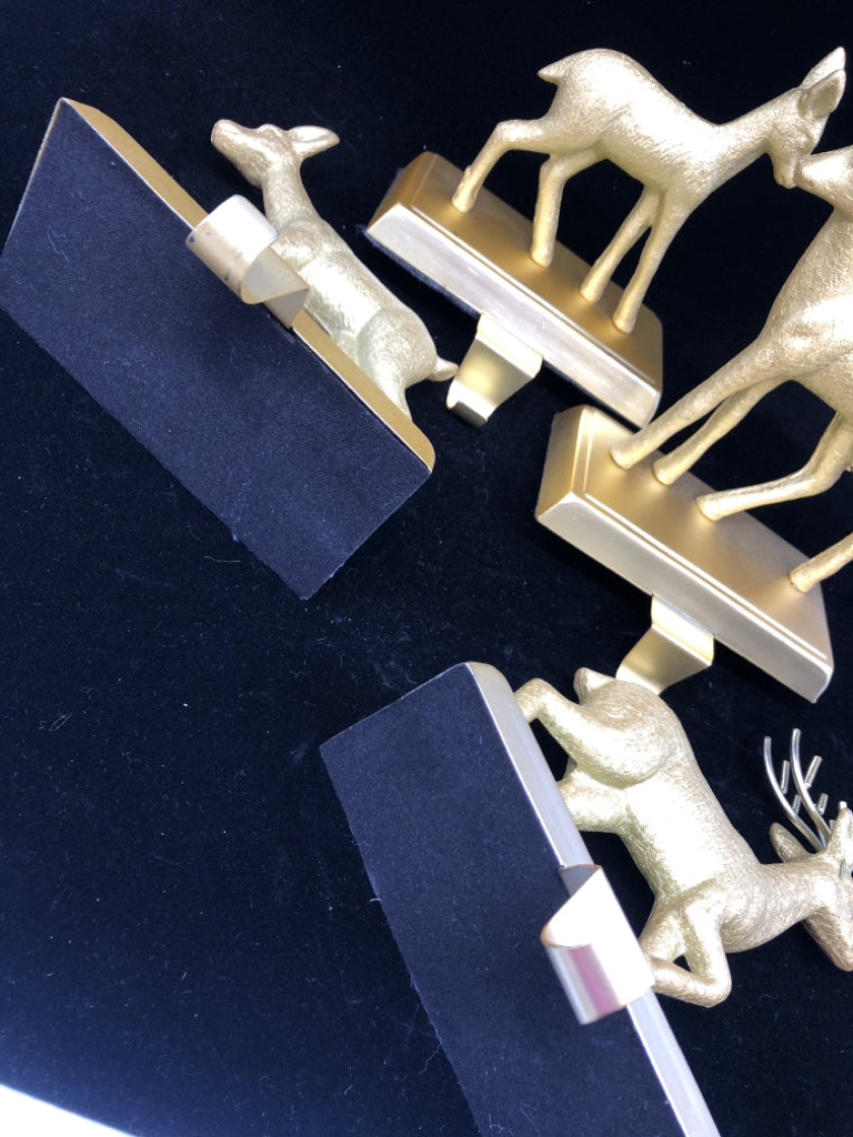 4 GOLD DEER STOCKING HOLDERS.