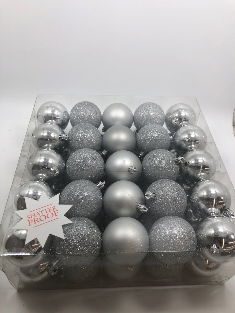 NIP 50PC SILVER ORNAMENTS.