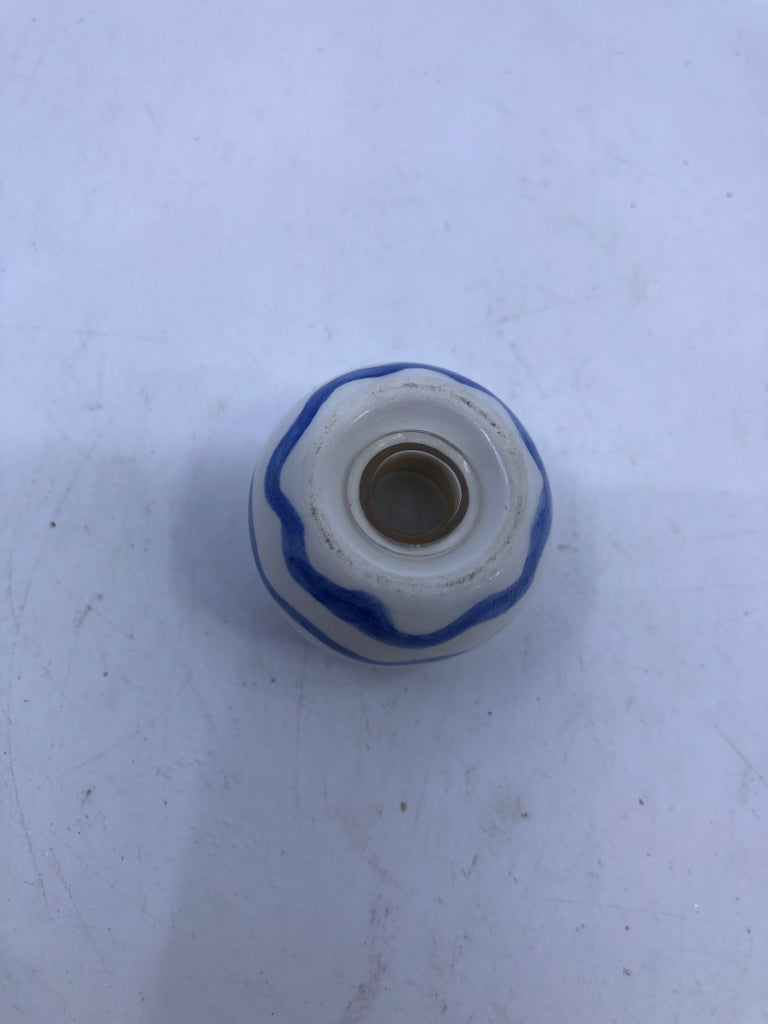 SMALL ROUND BLUE AND WHITE SALT AND PEPPER SHAKERS.