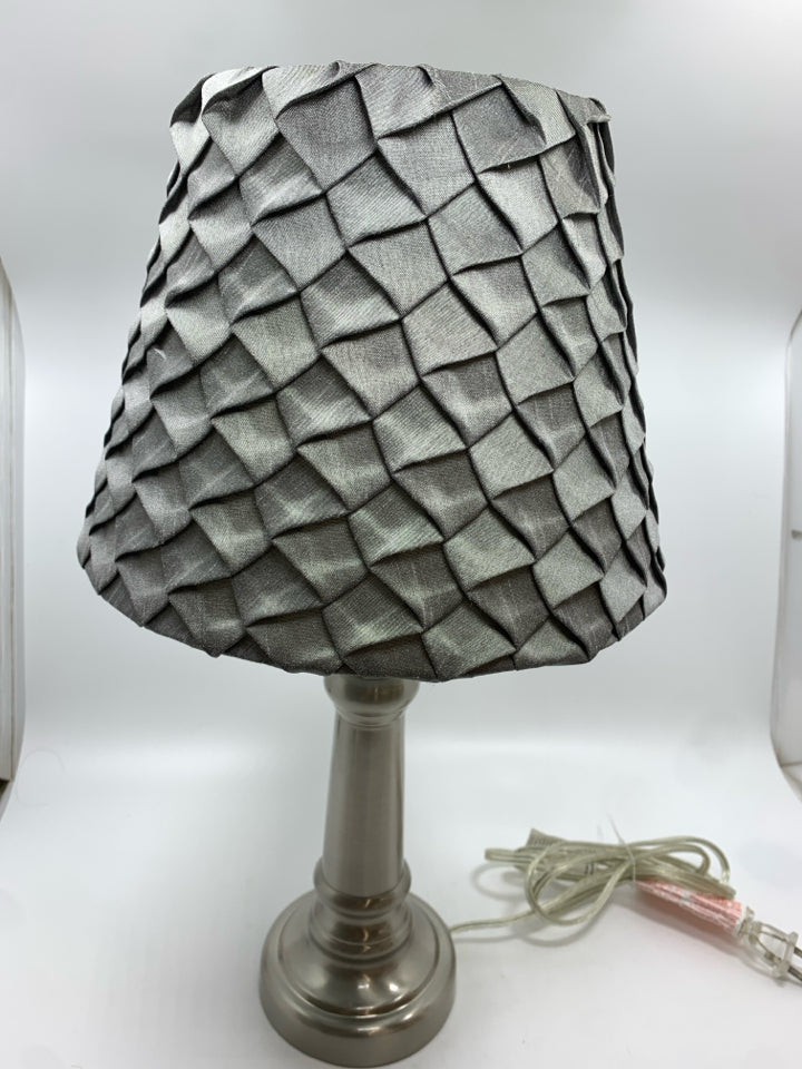 SILVER METAL BASE LAMP W/GREY PLEATED SHADE.
