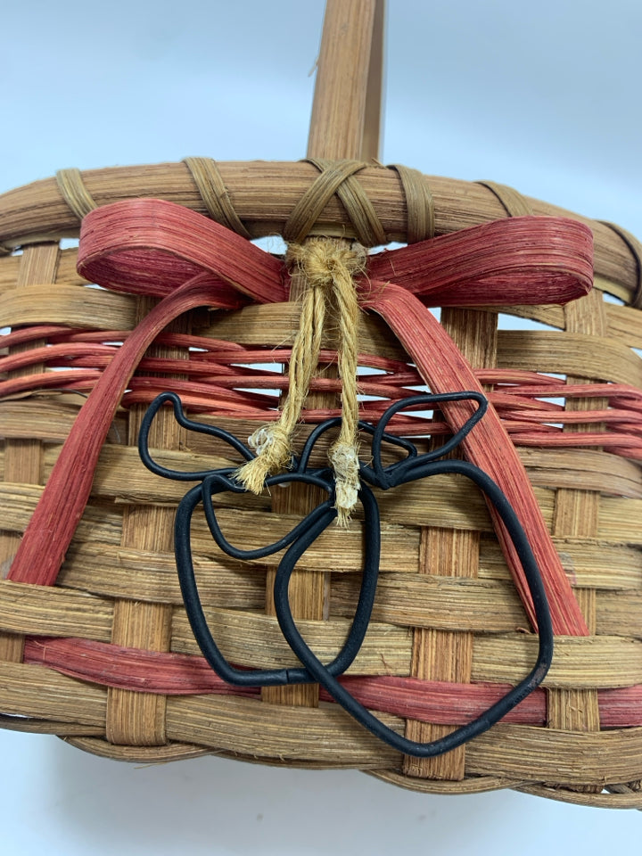OVAL BASKET W/PINK STRIPES AND METAL APPLES.