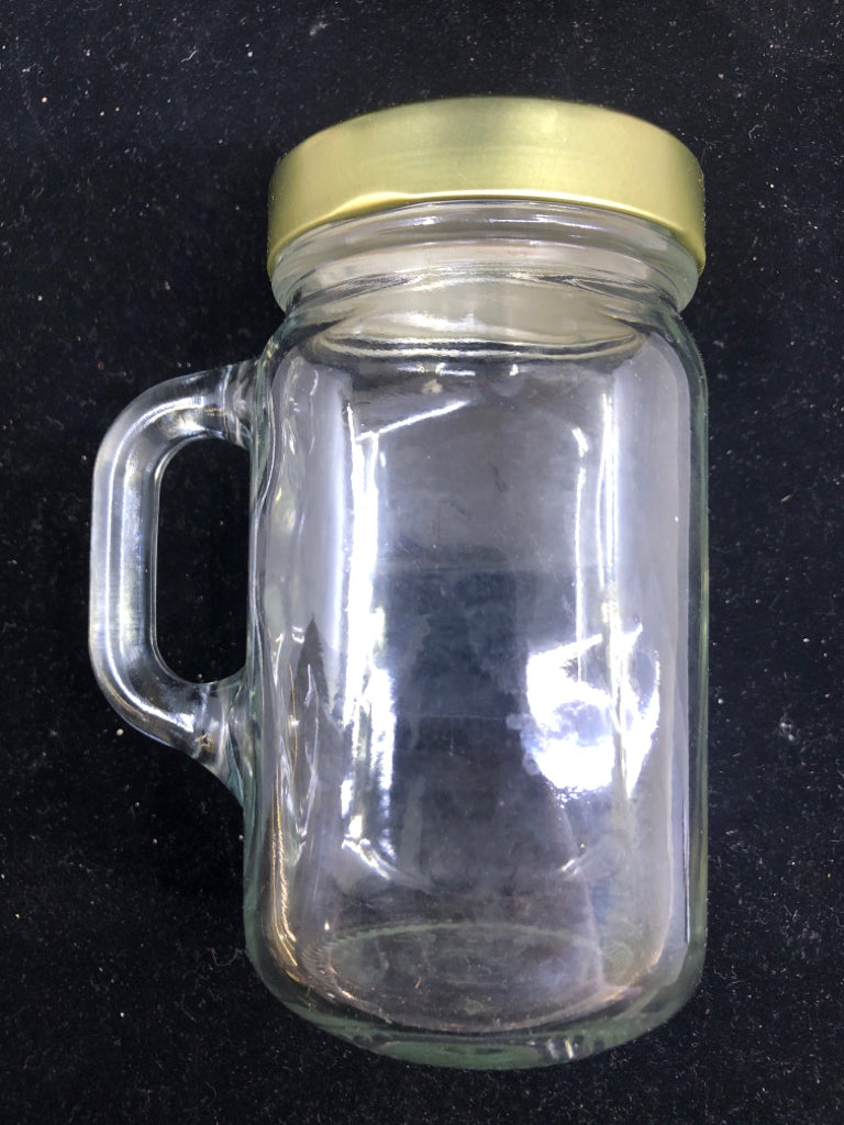 JAR STYLE MUG W HANDLE AND GOLD LID.