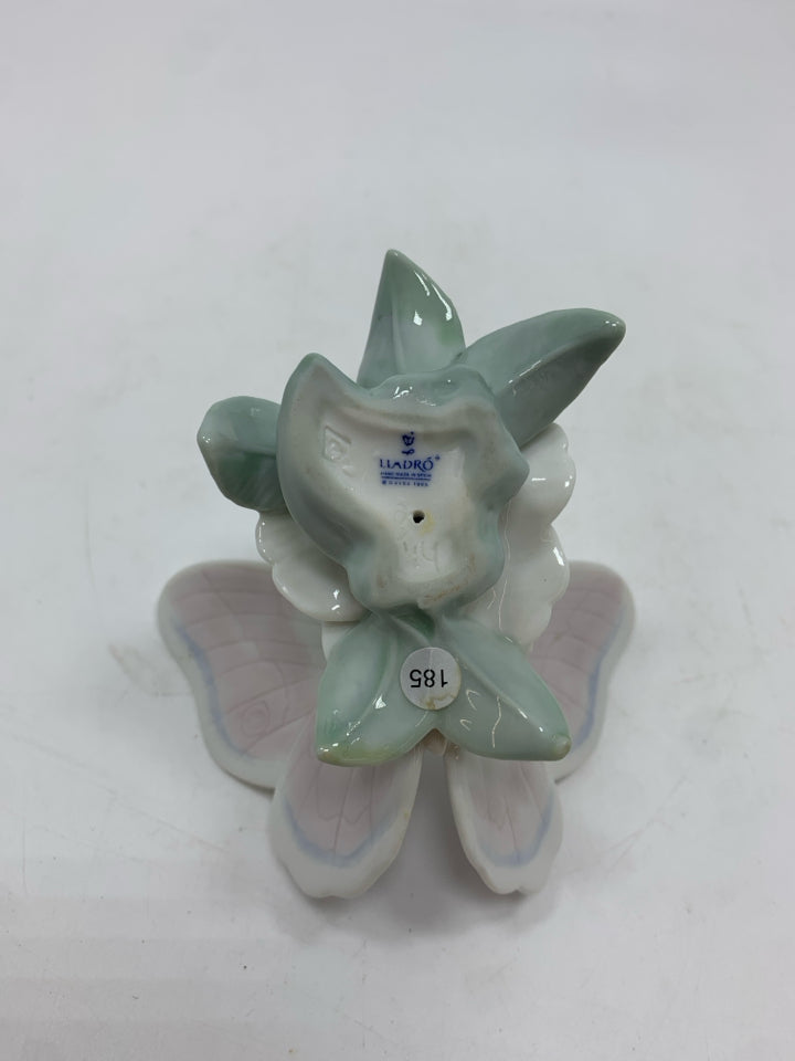 PORCELAIN BUTTERFLY ON FLOWER FIGURINE.