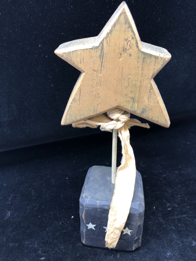 PRIMITIVE BROWN STAR ON BLACK BLOCK WHITE STARS.