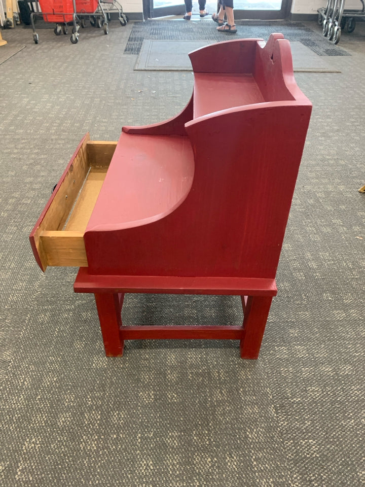 RED PAINTED WOOD TABLE WITH SHELF AND DRAWER.