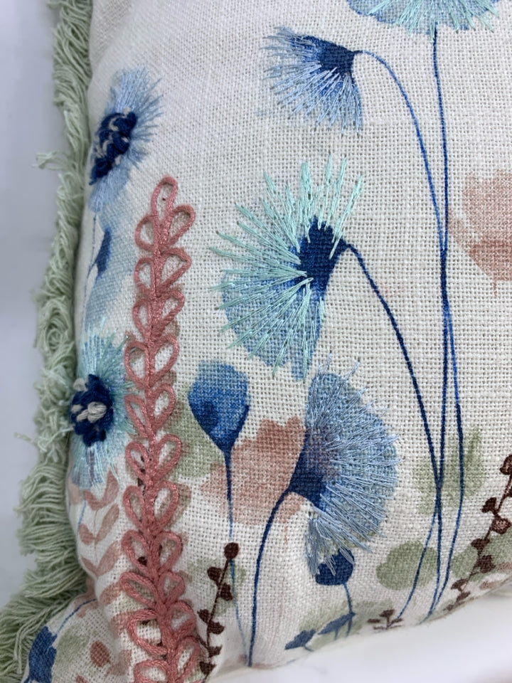FLORAL STITCHED ACCENT PILLOW W/GREEN FRINGE.